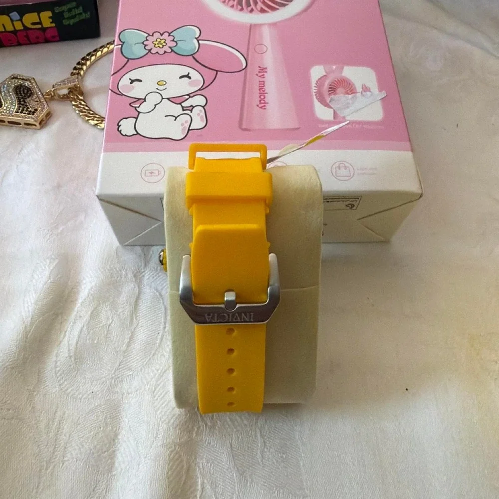 Invicta blue watch with white stripes on the band Blue, Red, yellow, Green